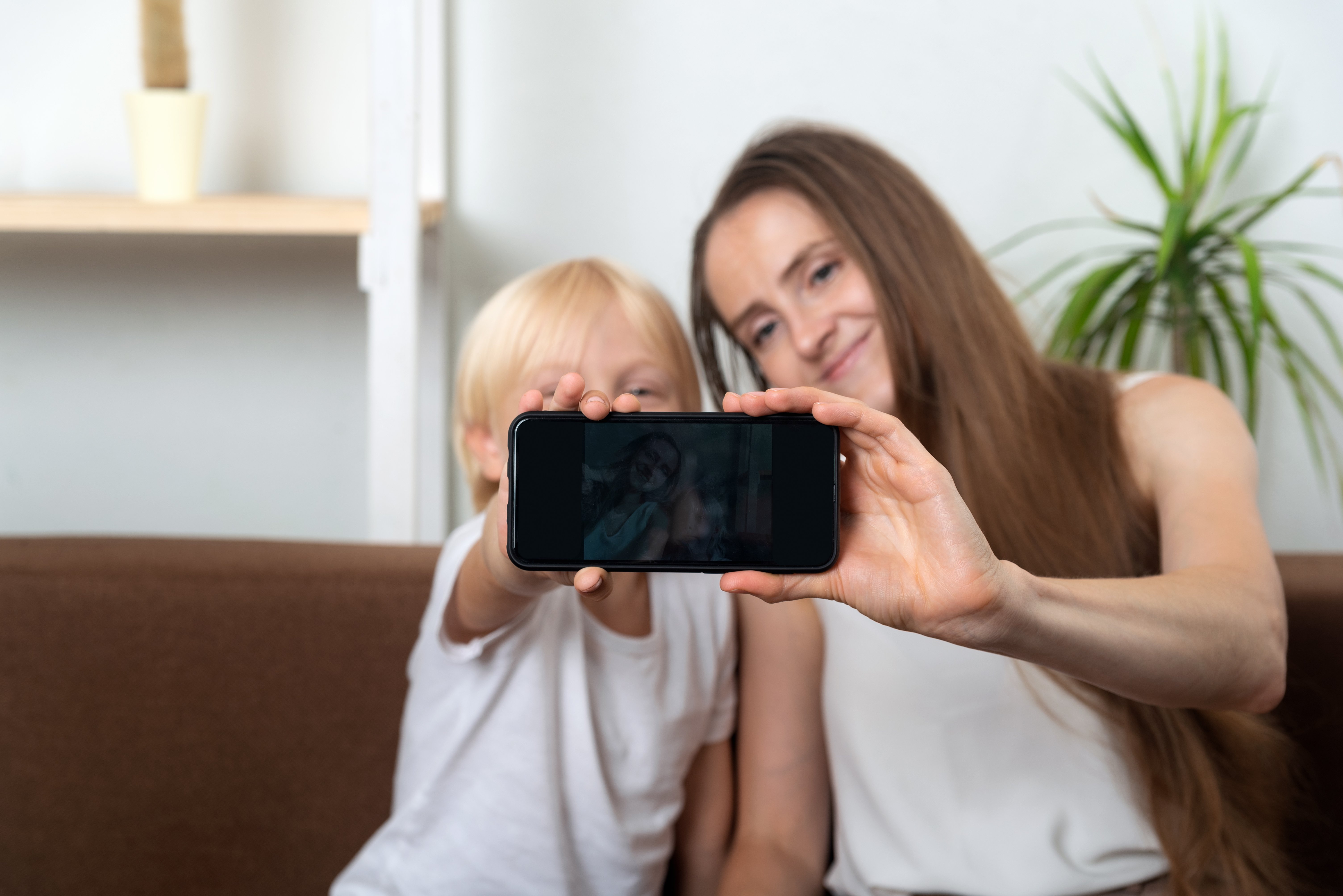 young-mom-takes-selfie-with-her-son
